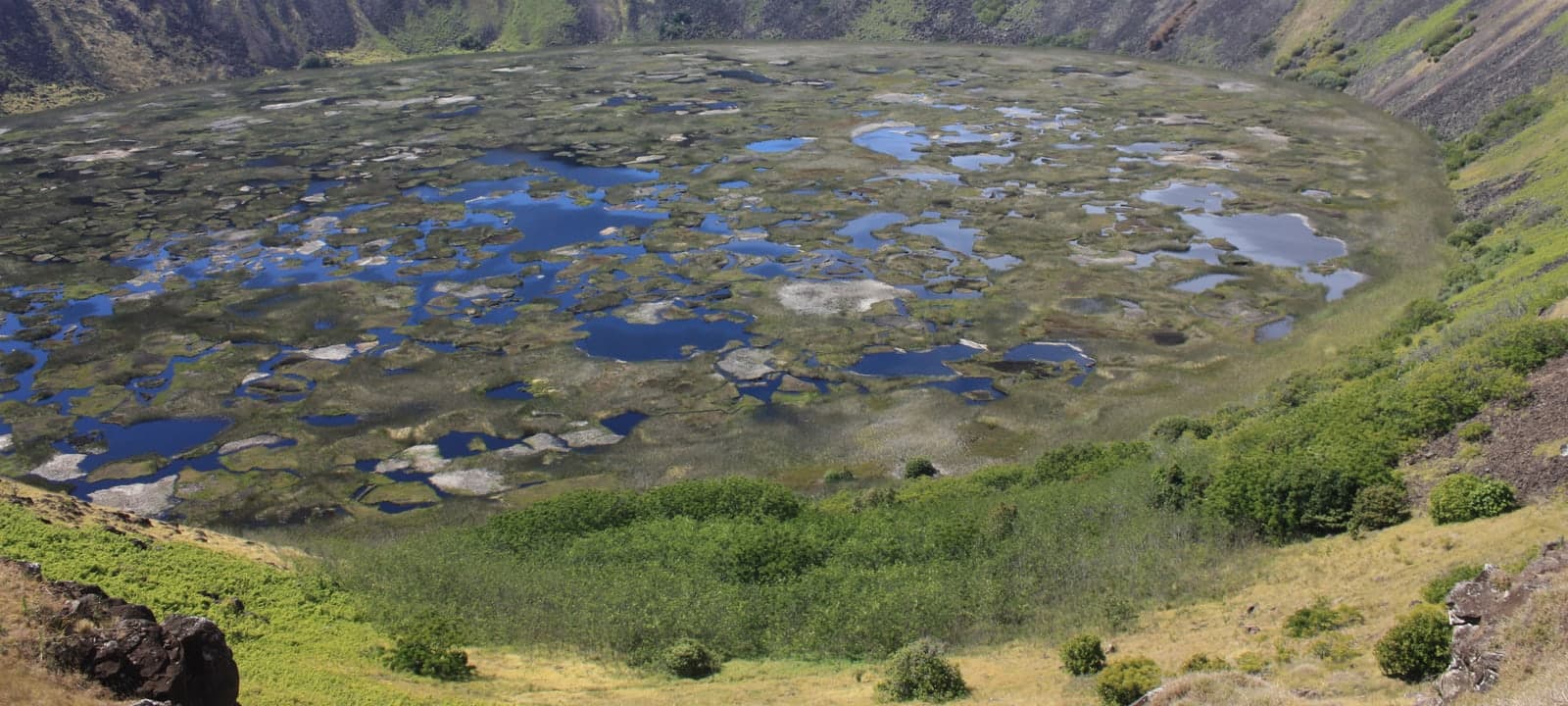 Volcanic coastline with surf and sea spray.