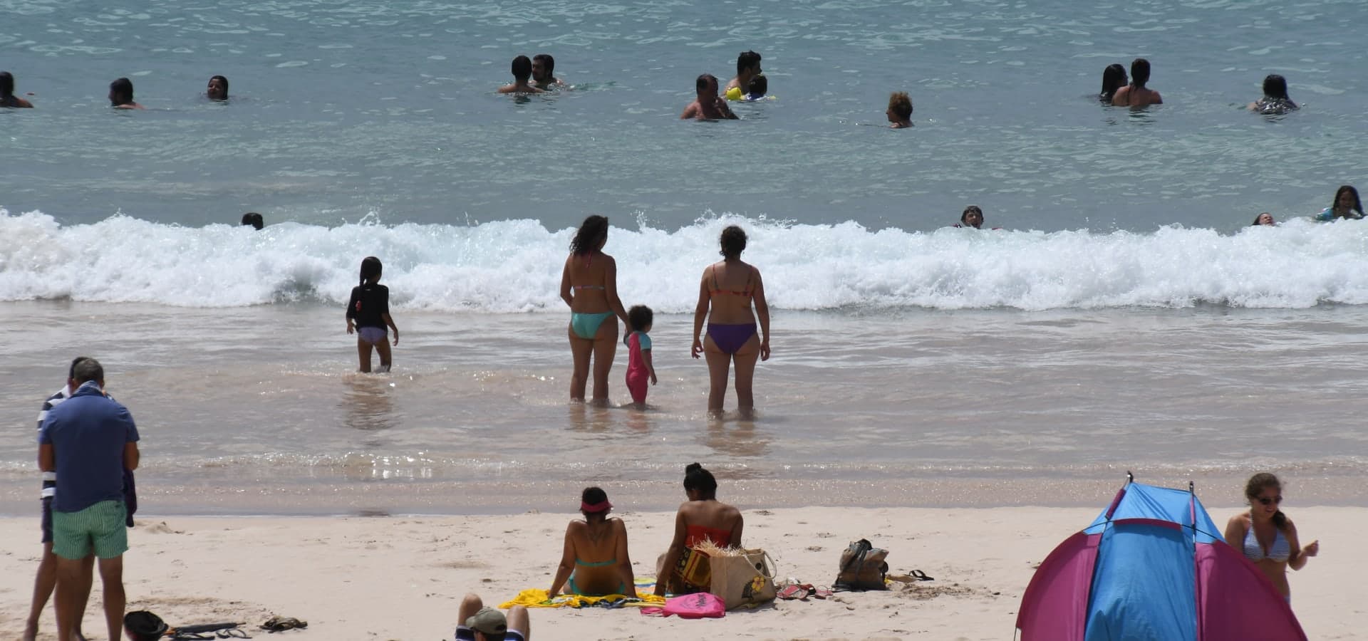 Palm-lined coastal road at dusk, suggesting island life and travel logistics.